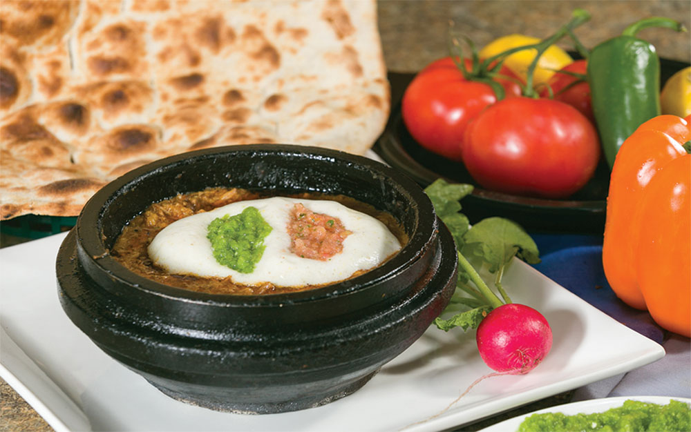 Traditional Yemeni saltah served in a hot stone pot